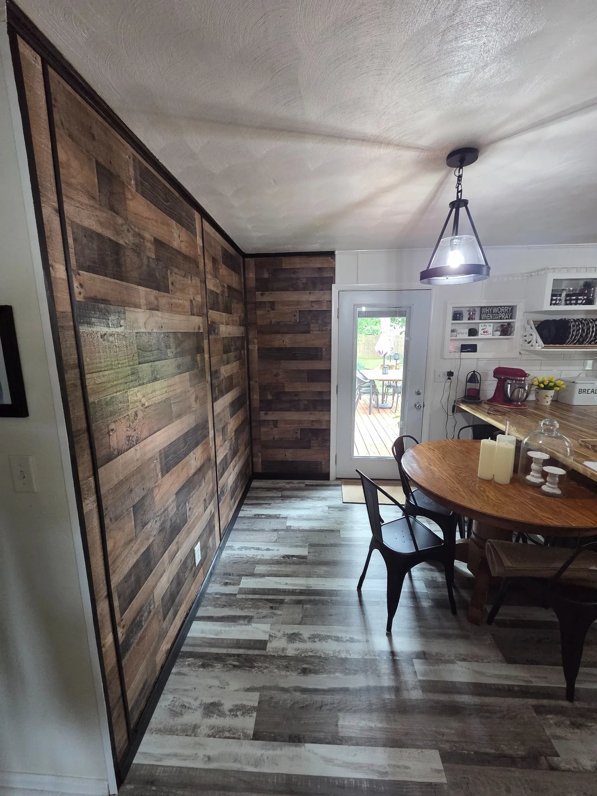 Completed wood accent wall alongside a dining area