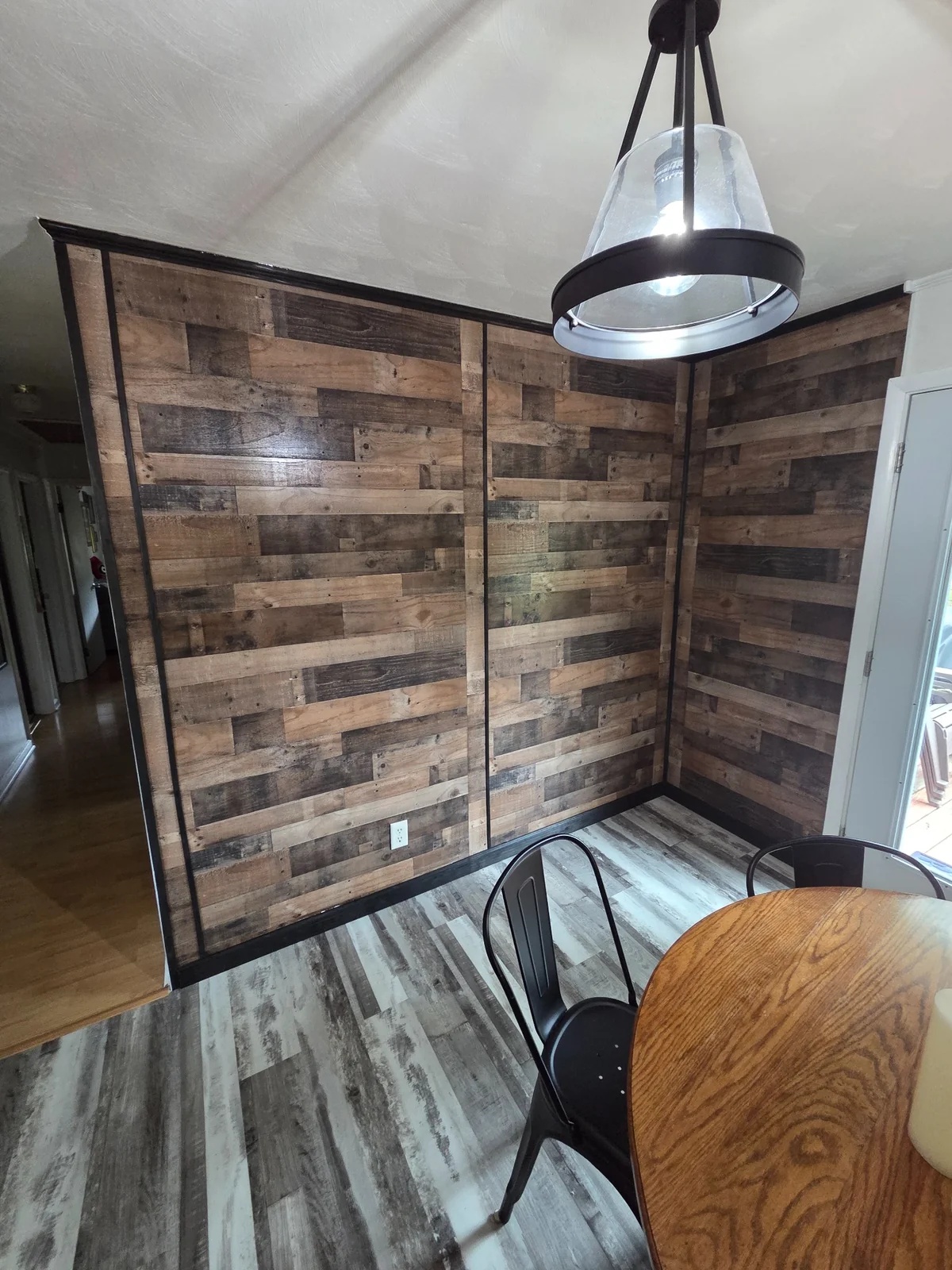 Finished wood accent wall in a dining room