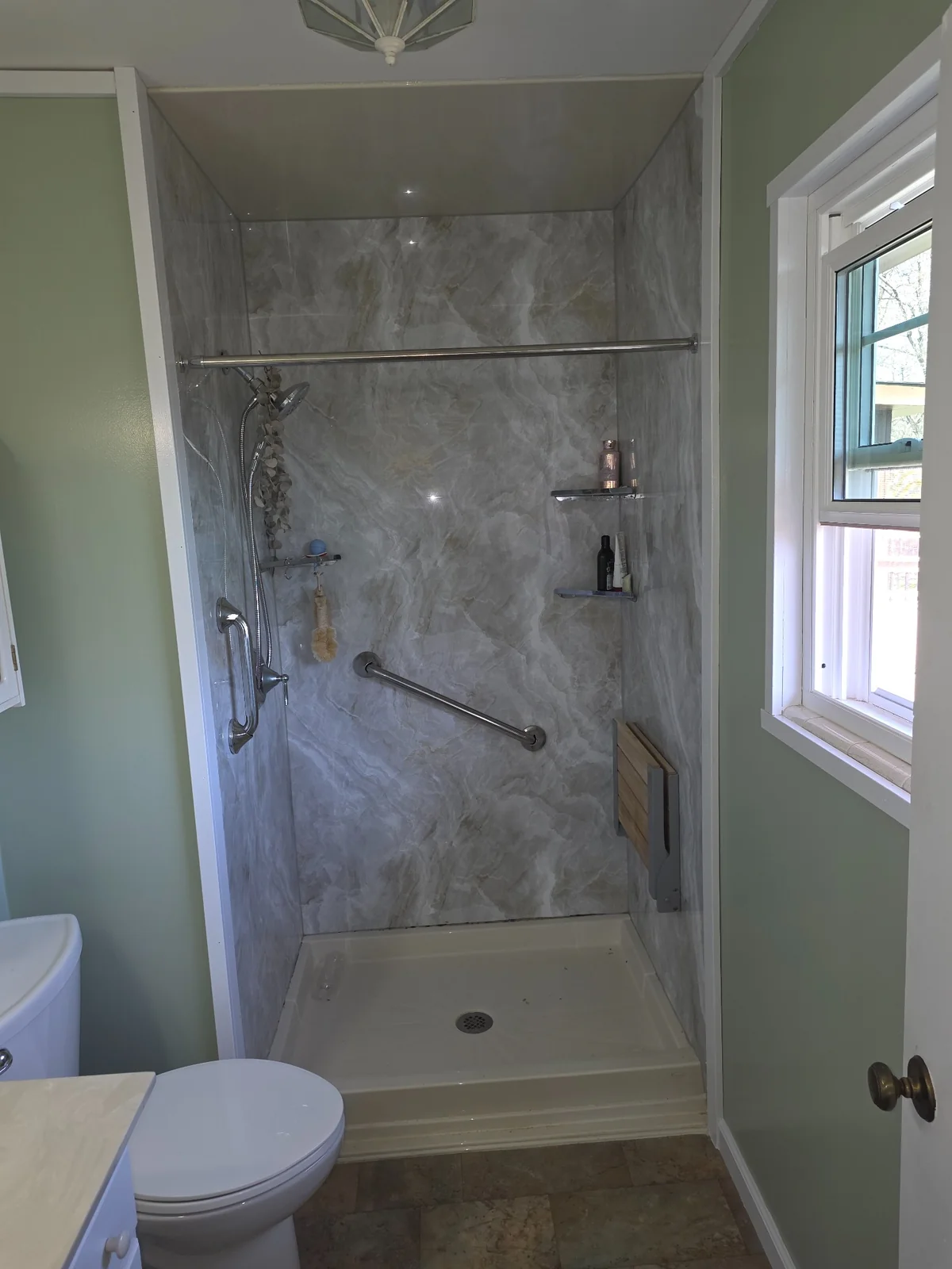 Shower enclosure and adjacent bathroom window