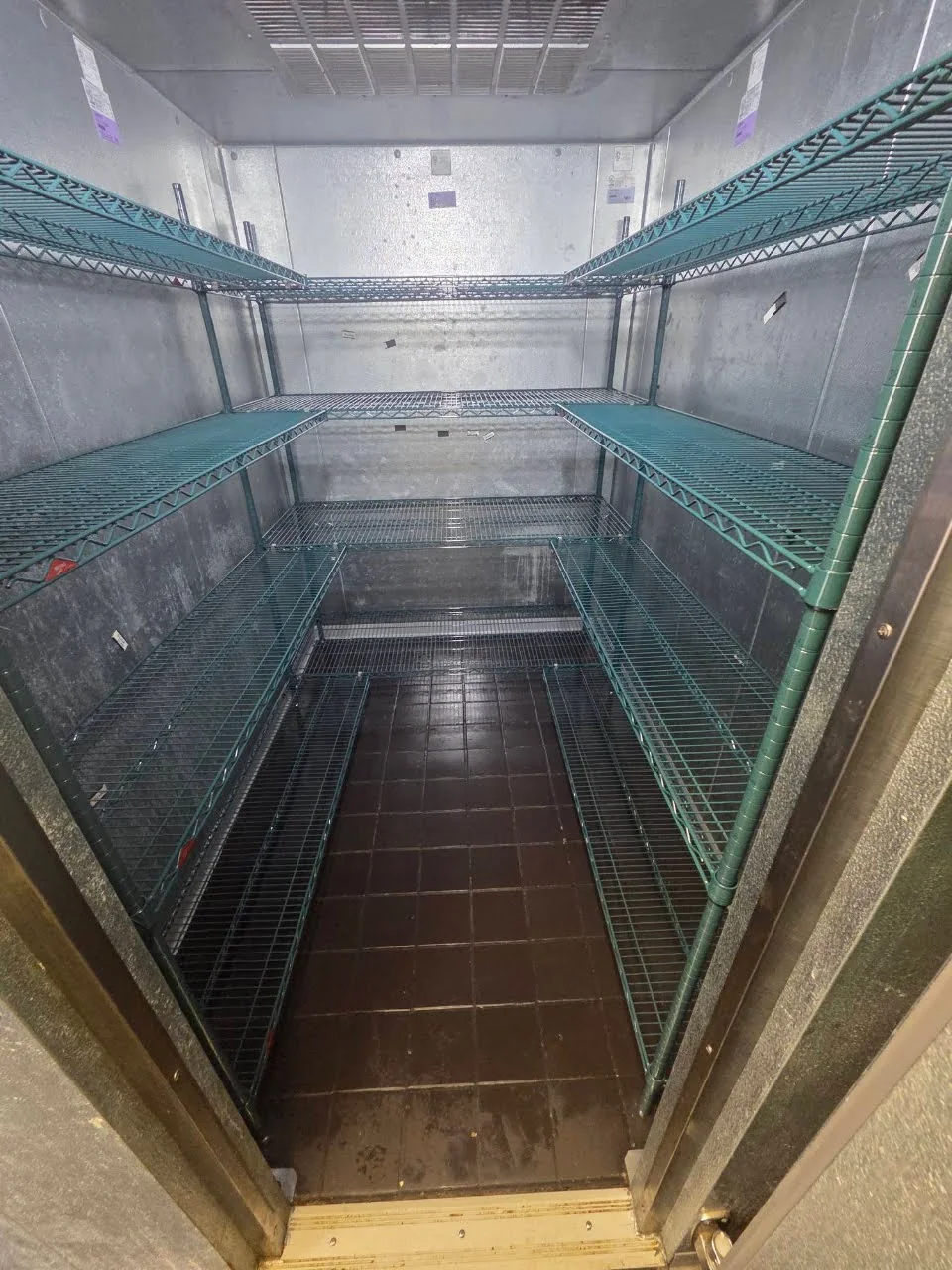 Shelving inside a commercial walk-in cooler