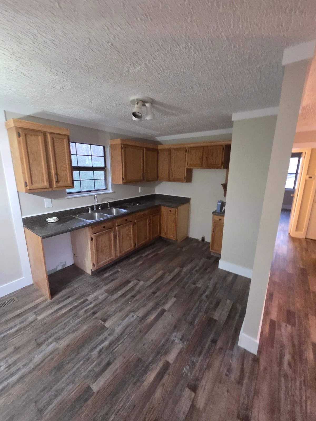 Finished kitchen with painted walls, cabinets and flooring