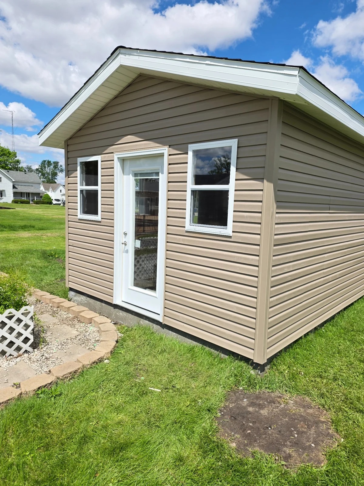 Outbuilding entry door, windows and trim