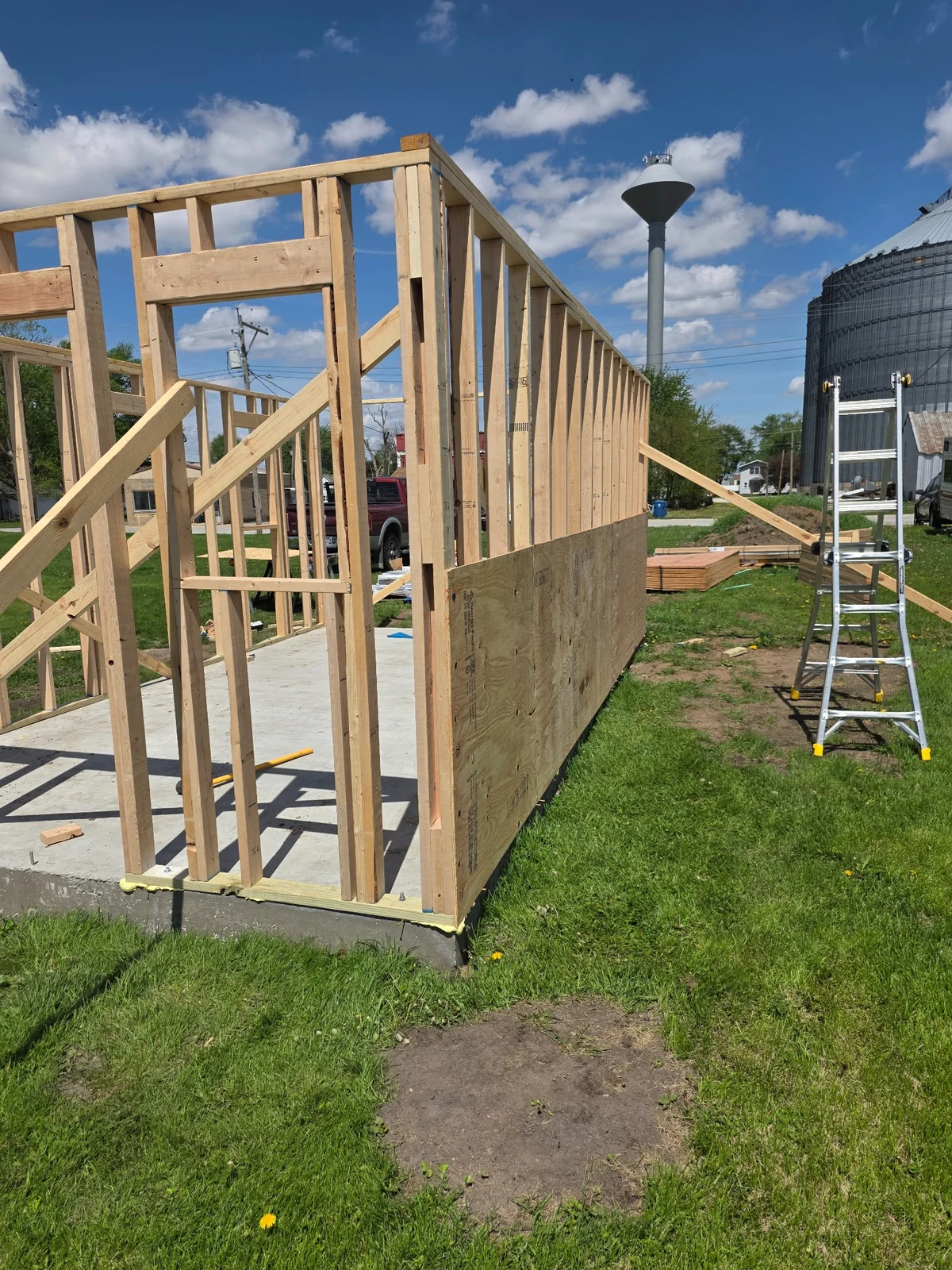 Outbuilding wall framing erected on a concrete slab