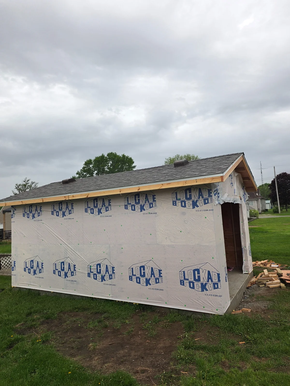 Outbuilding exterior covered with housewrap