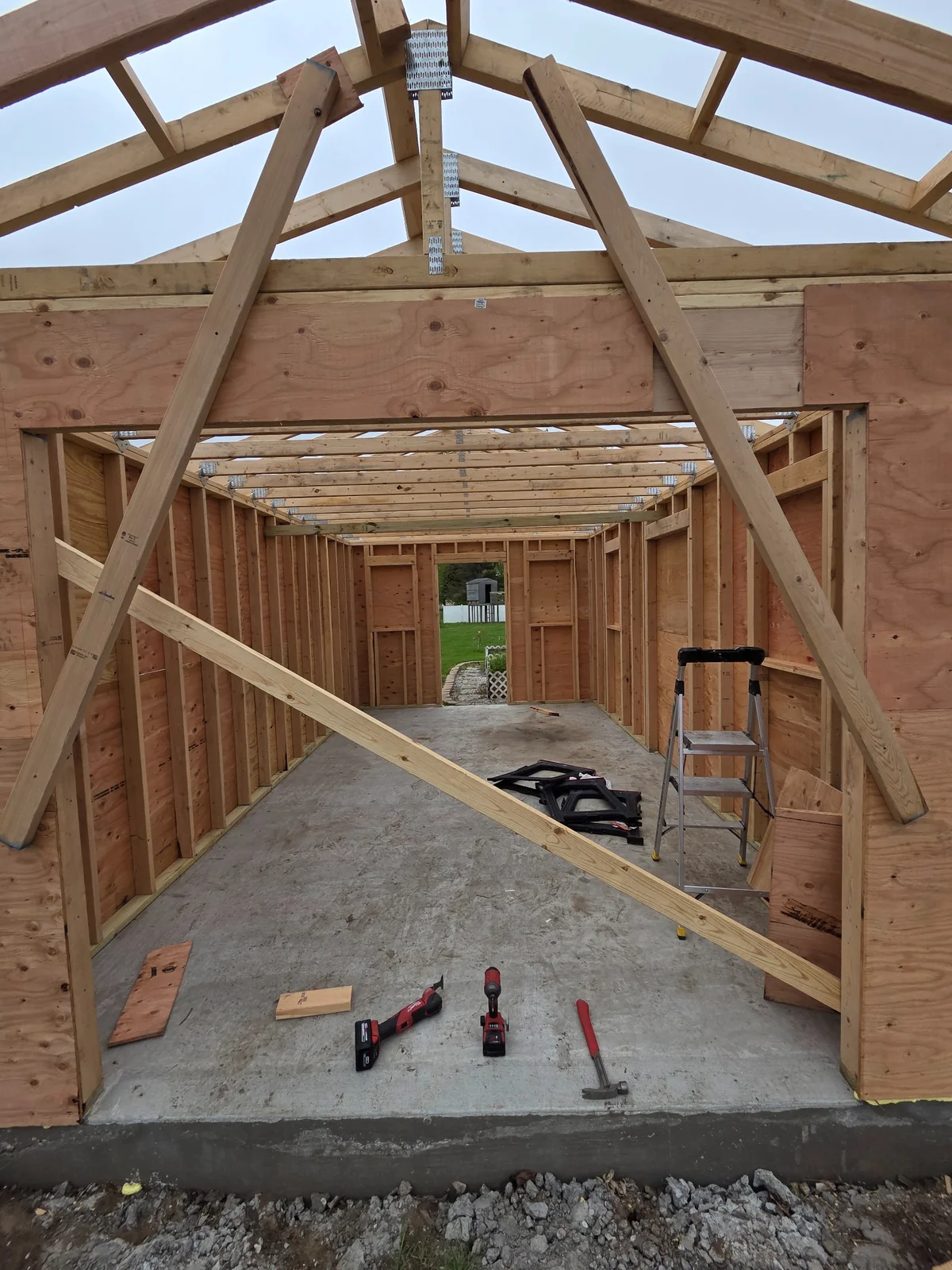 Roof framing viewed from inside the outbuilding